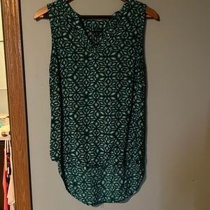 Teal and white sleeveless blouse